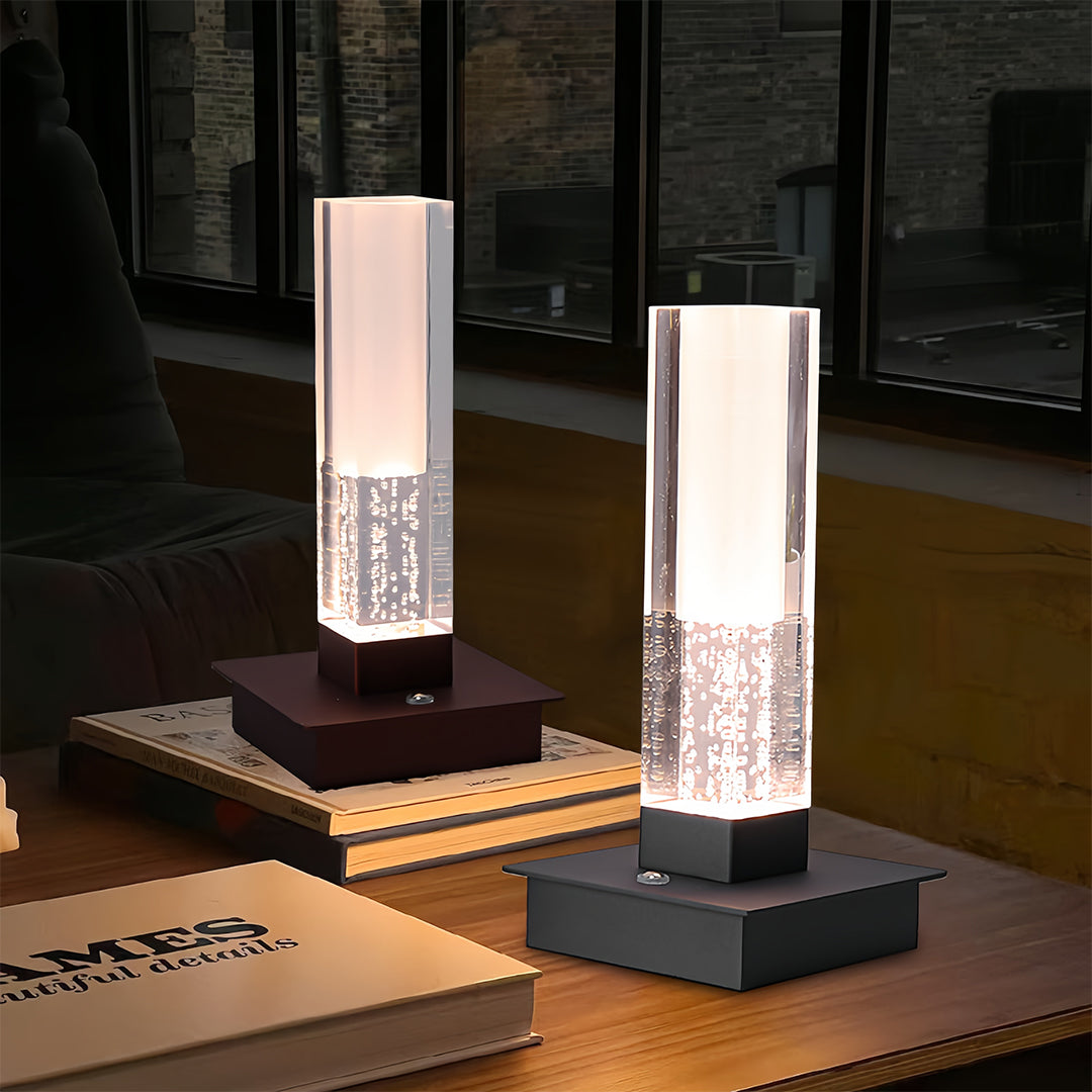 Contemporary interior showcasing small black pendant light collection with various square base finishes