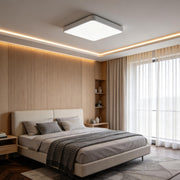 Square ceiling light installed in a modern bedroom with soft ambient lighting.