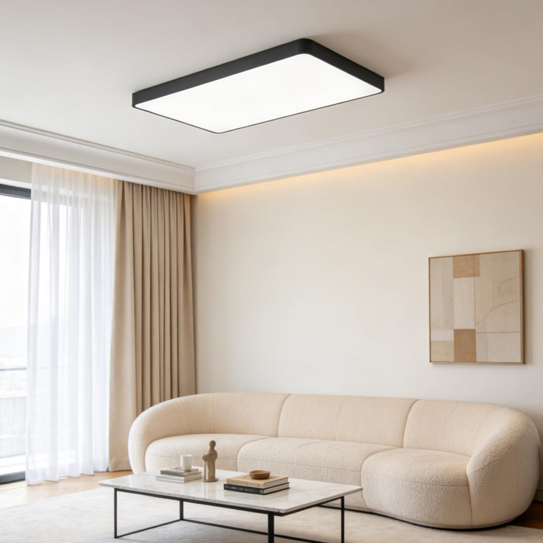 Square ceiling light mounted in a minimalist living room interior.