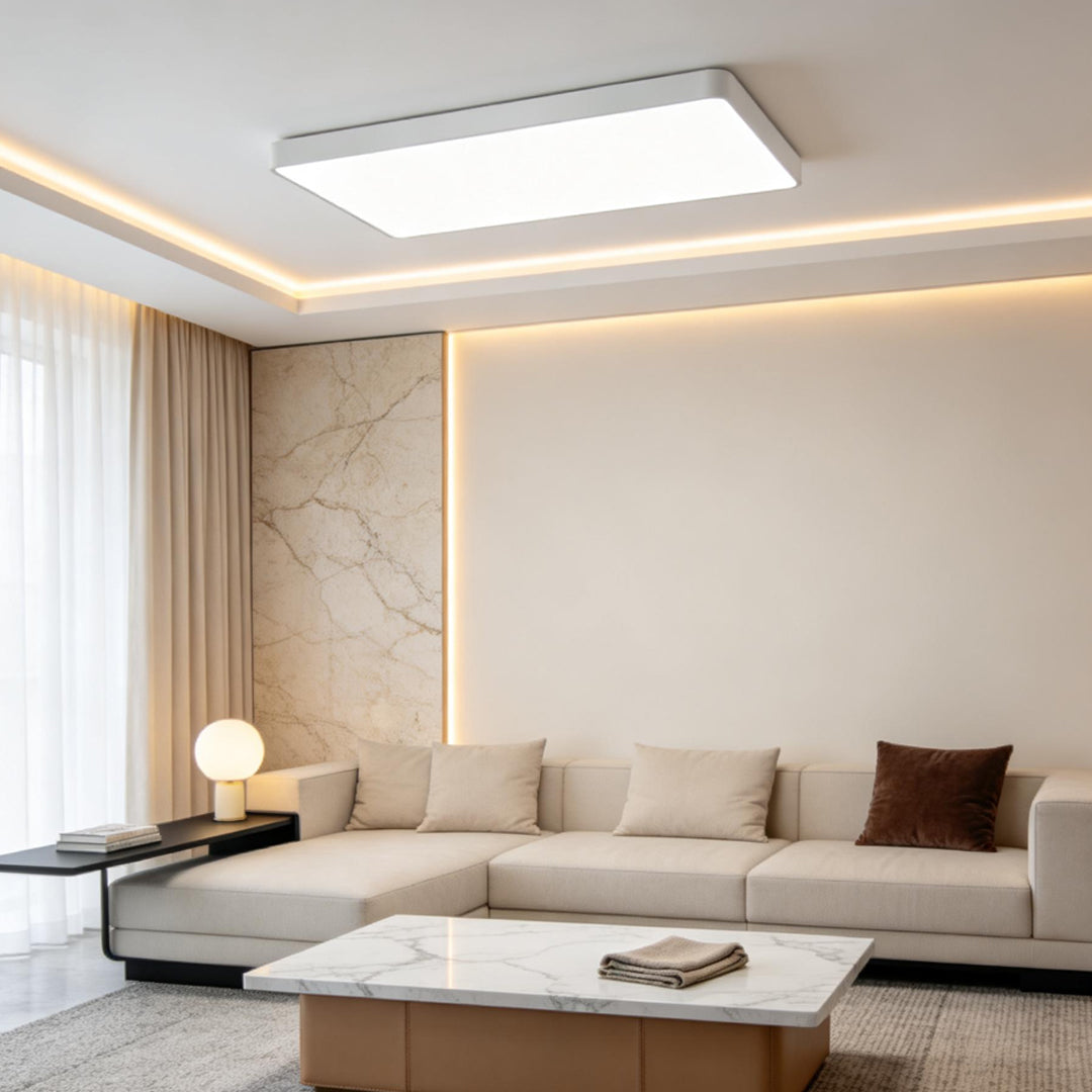 Square ceiling light illuminating a neutral-toned living room space.