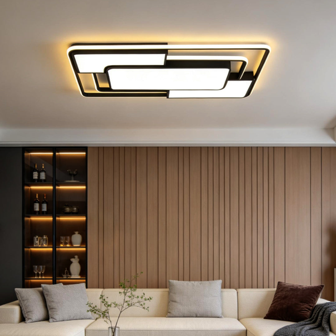 Square flush mount ceiling light illuminating a contemporary living room with wood accent wall