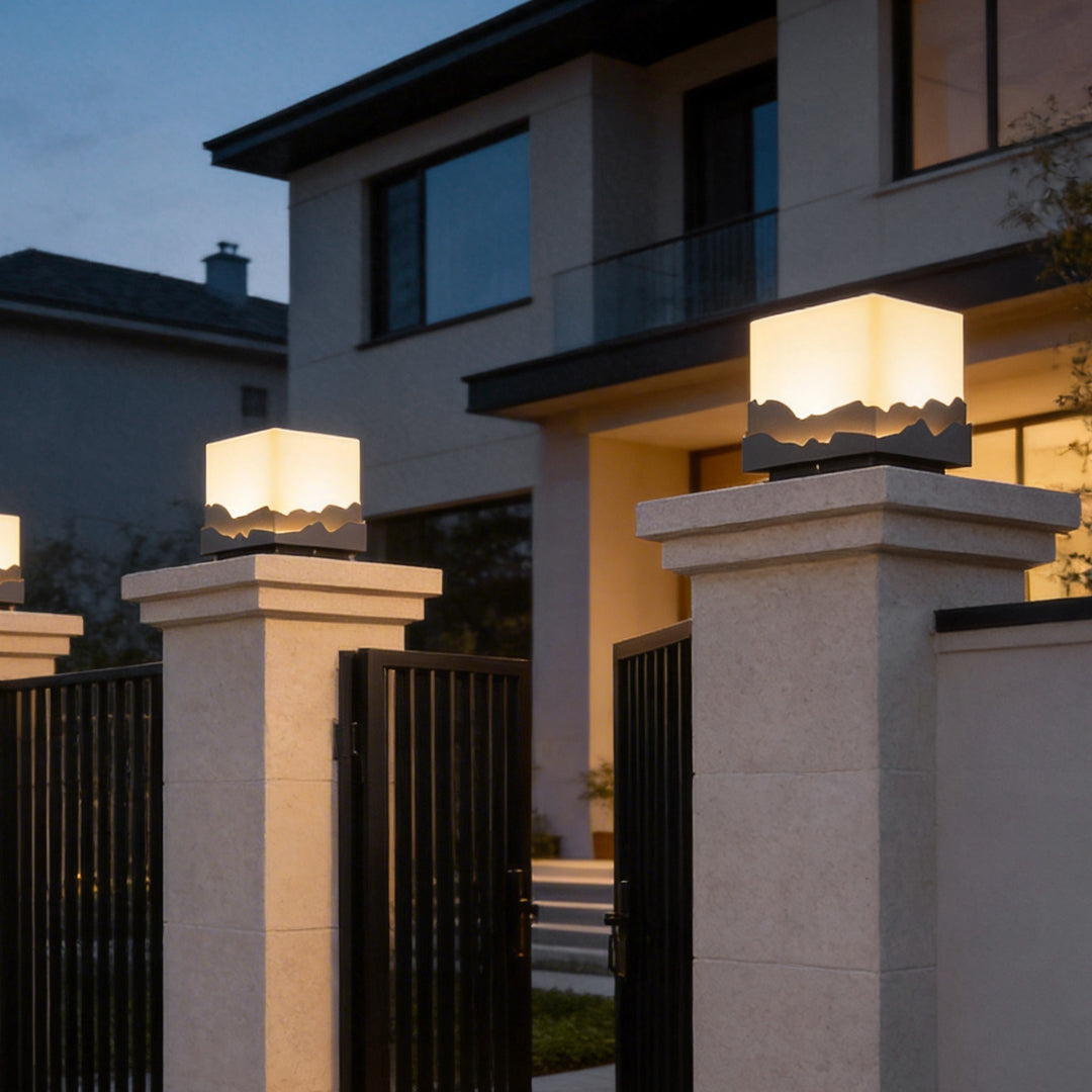 Square landscape light enhancing a contemporary house entrance with soft ambient glow.