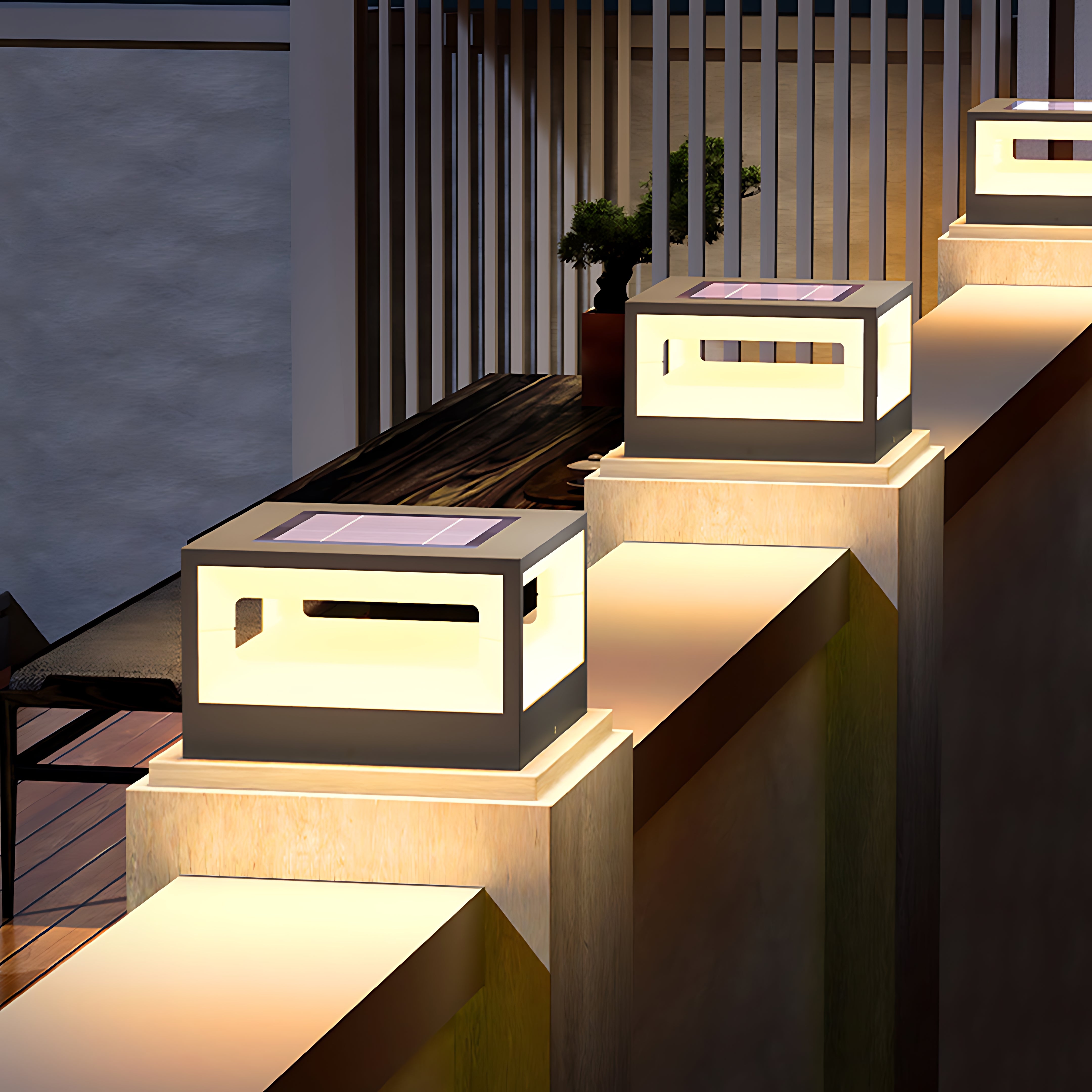 Square LED lights mounted on modern concrete steps illuminating contemporary residential entrance with warm glow