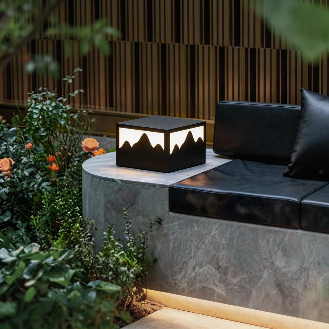 Square outdoor lights enhancing a contemporary patio with soft ambient glow.