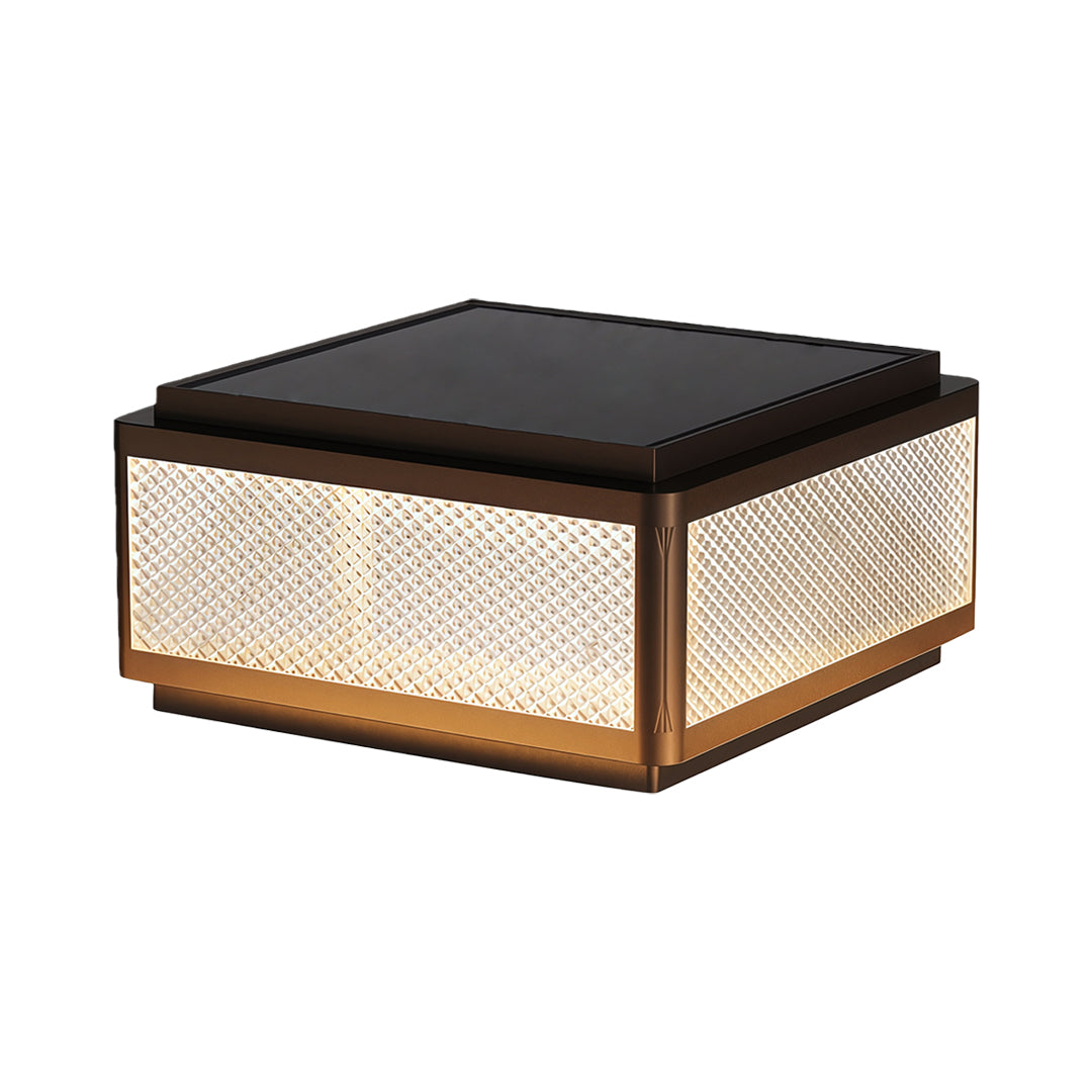 Square outdoor pillar light featuring a minimalist design with a textured top and warm light.