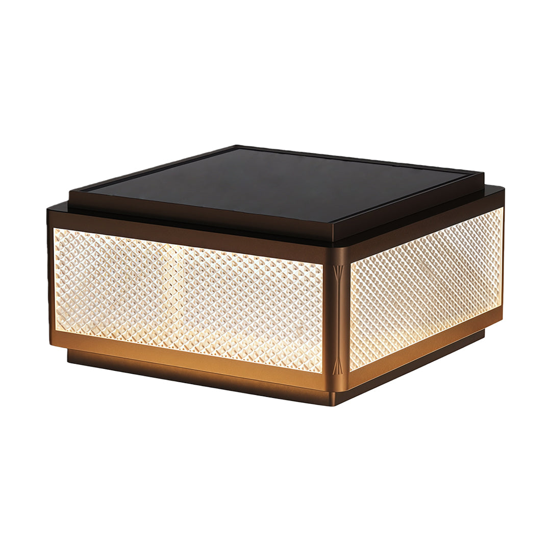 Square outdoor pillar light installed near a railing with a scenic view, providing warm and inviting illumination.