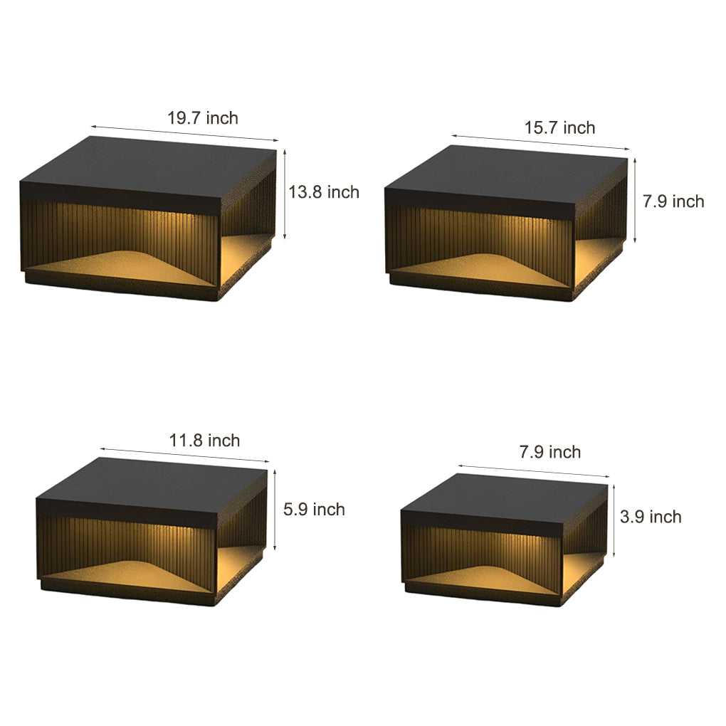 Close-up view of square outdoor pillar lights highlighting LED light source and interior texture.