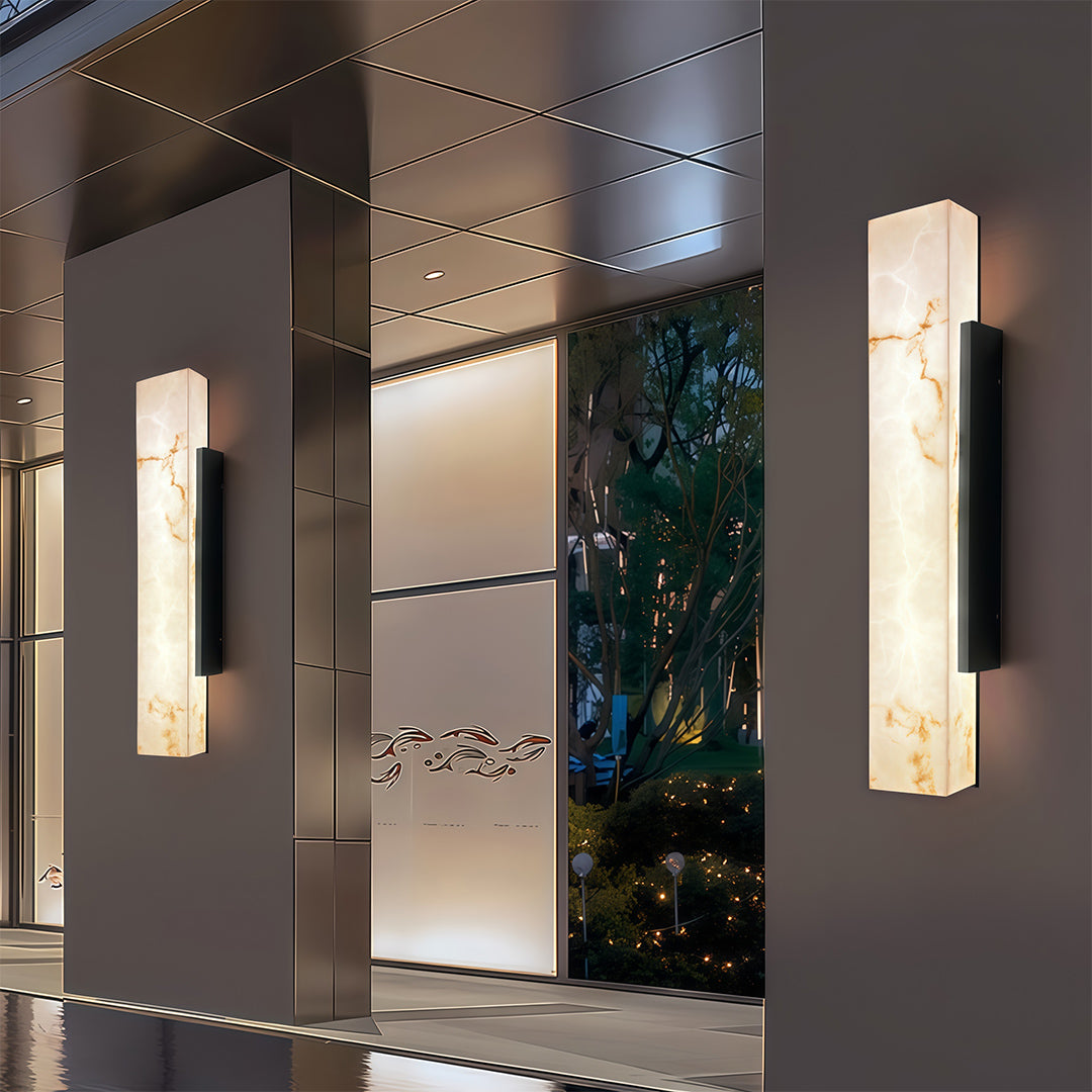 Square outdoor wall lights illuminating a modern hallway, enhancing the architectural details.