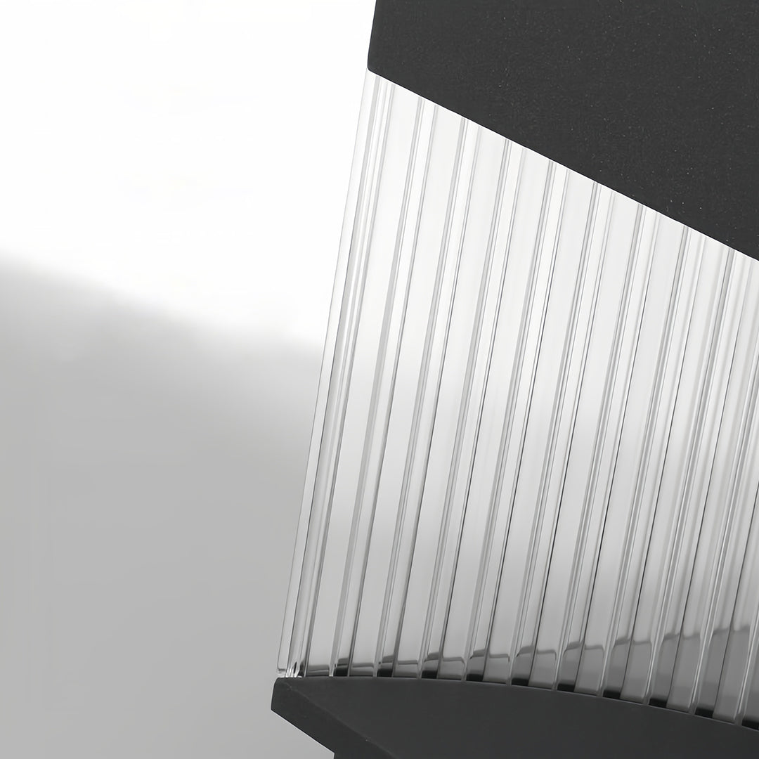 Close-up angle view of square pillar lights highlighting ribbed texture and architectural form