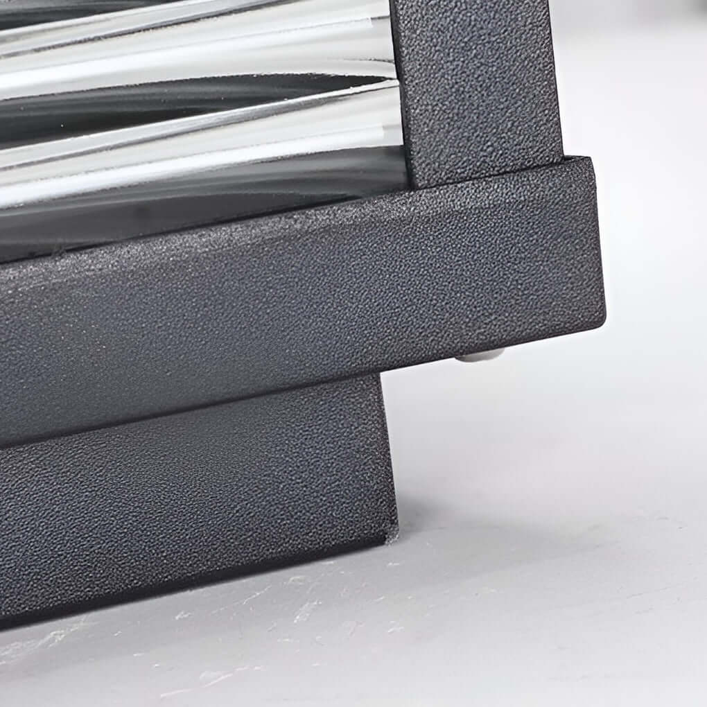 Square pillar light ribbed glass outdoor metal light adds decorative and functional lighting to patios, walkways, and exterior areas.