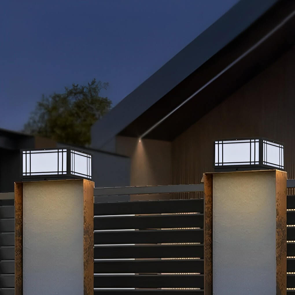 Square pillar light placed on outdoor fence pillars, providing clean architectural lighting along a modern boundary wall.