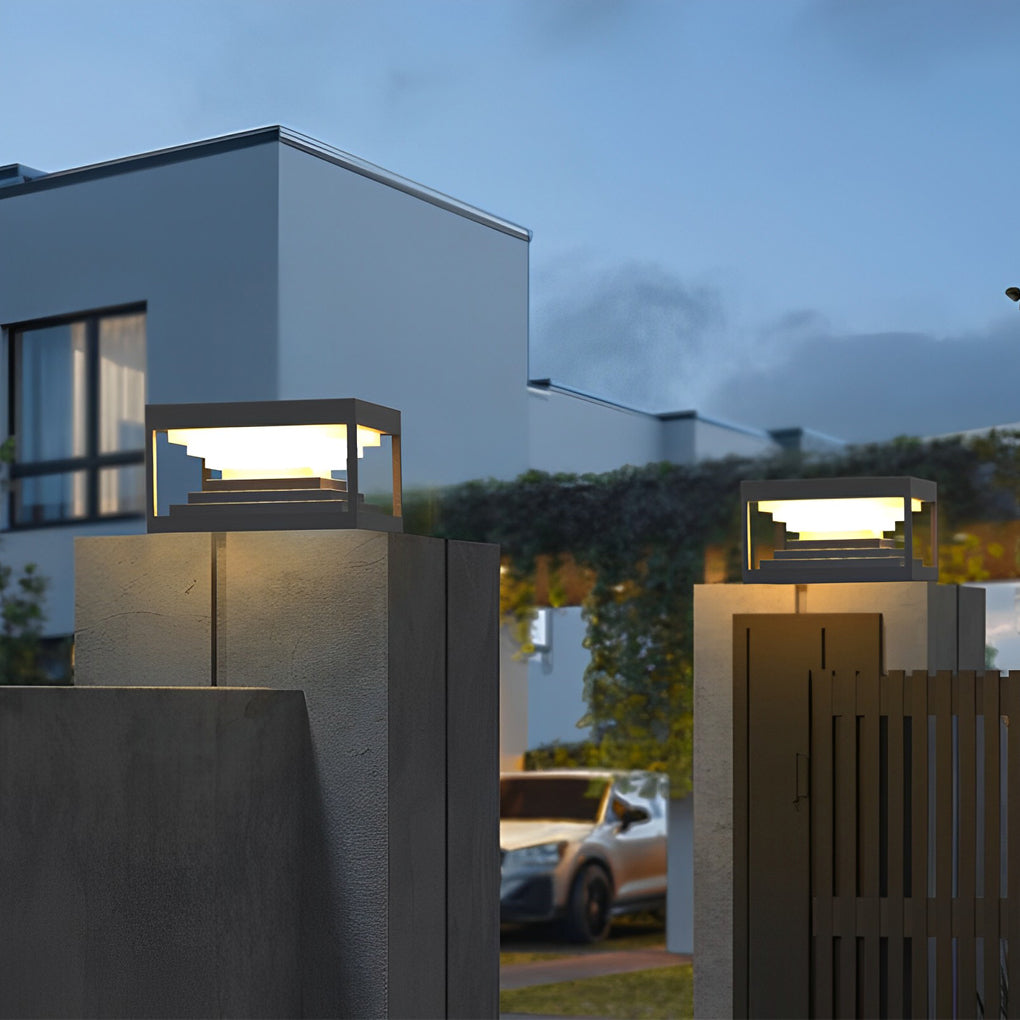 Square pillar lights providing elegant illumination for a contemporary patio.