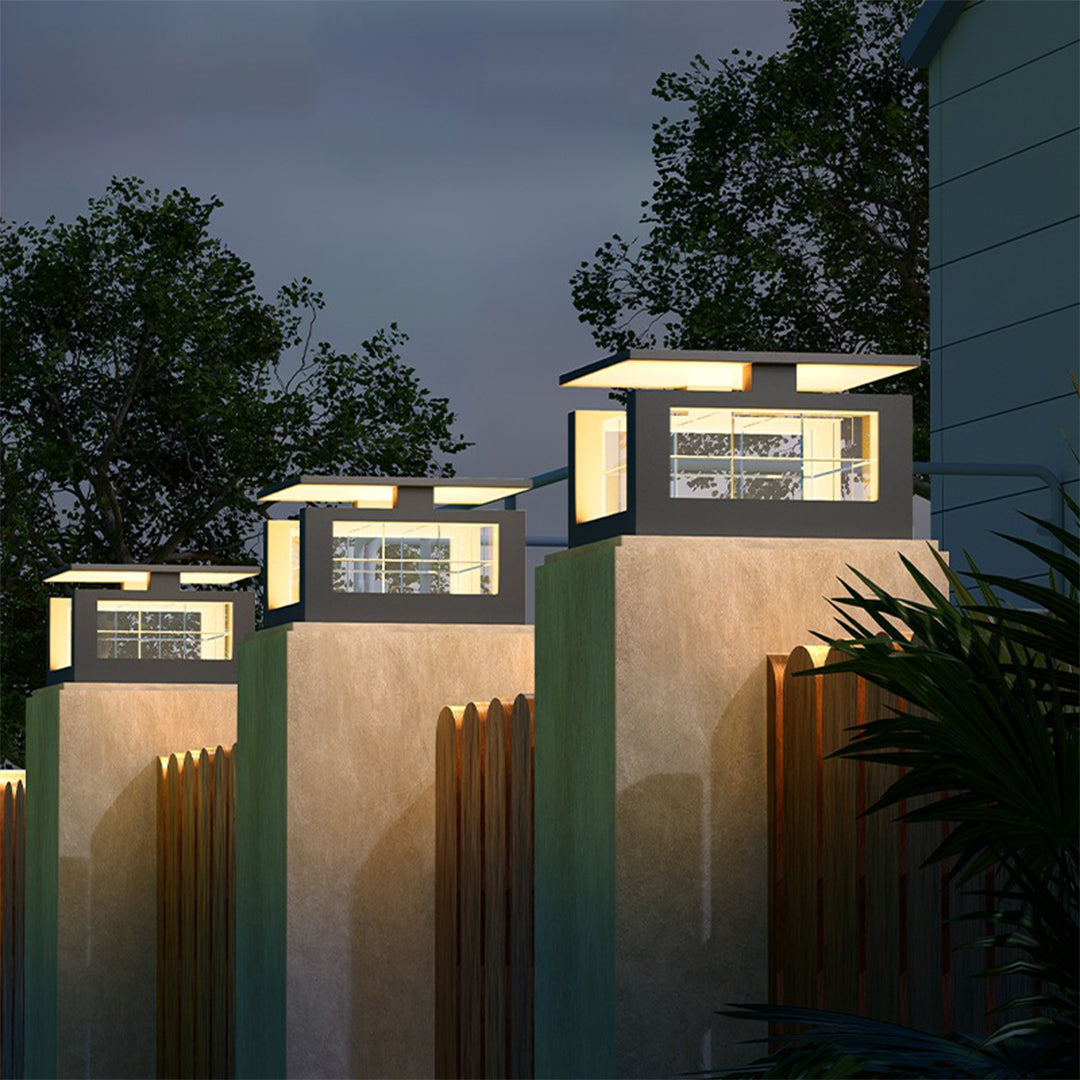 Modern square post lights with integrated LED panels providing elegant illumination for contemporary residential entrance