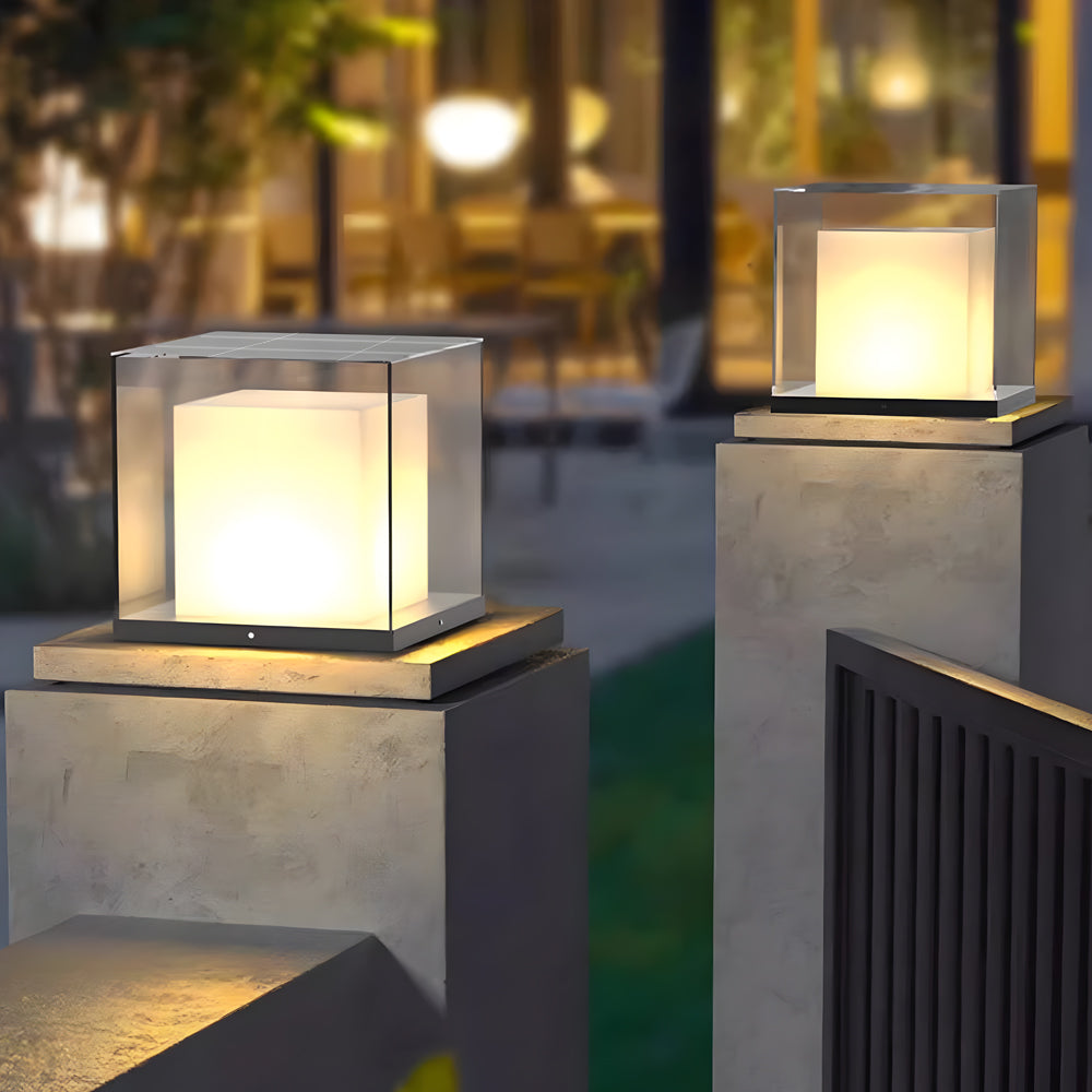Square gate pillar lights providing elegant illumination for residential driveway entrance