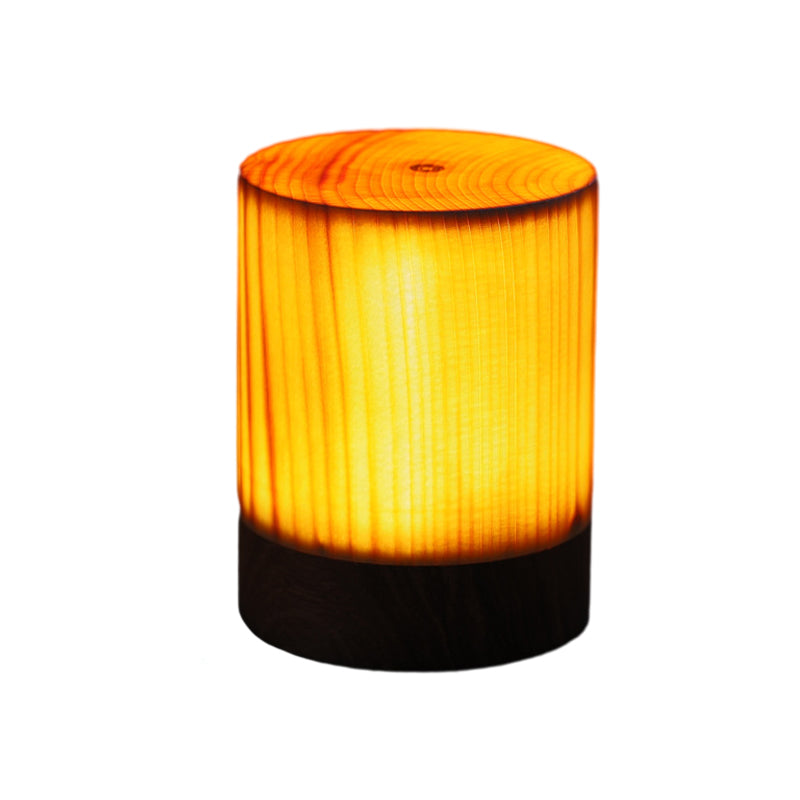 Square wood lamp in cylindrical shape, side view of the black base.