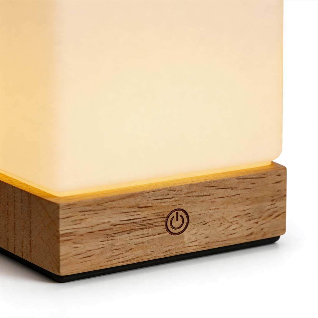 Square wood lamp with a touch control, providing ambient lighting.