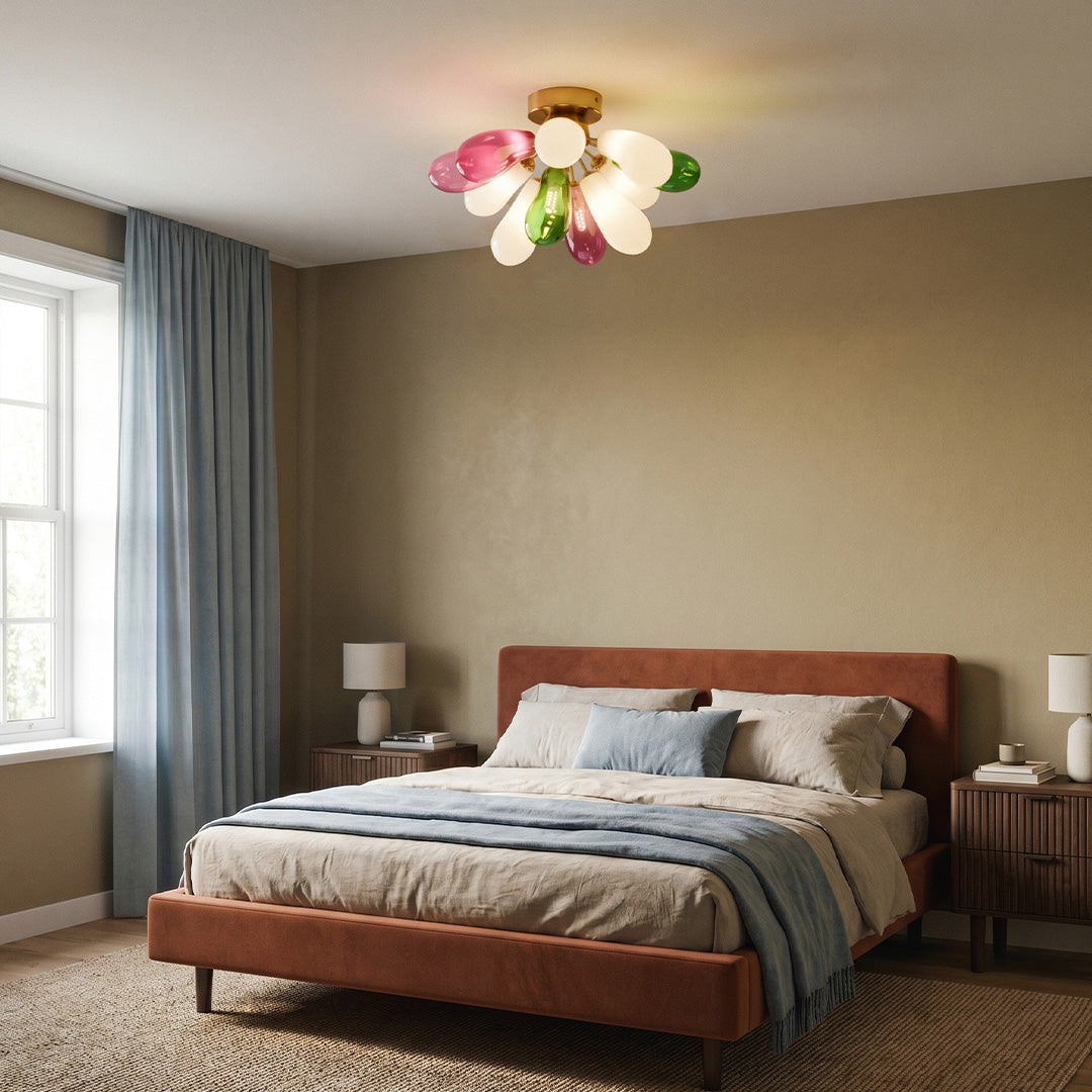 Multi-color stained glass ceiling light fixture illuminating a cozy bedroom with soft ambient lighting.