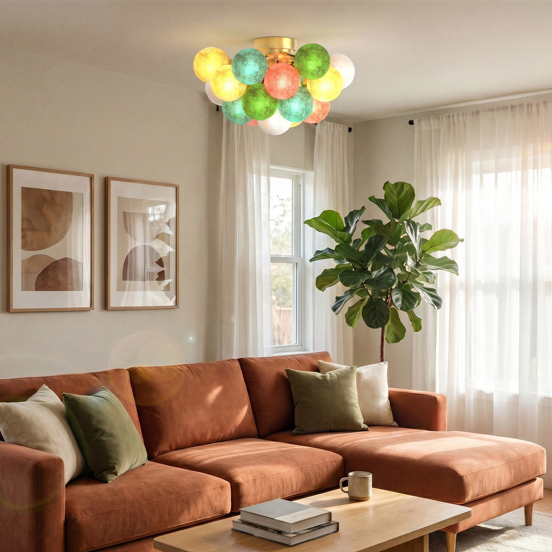 Stained glass flush mount ceiling light with vibrant globe shades in a bright contemporary living space.
