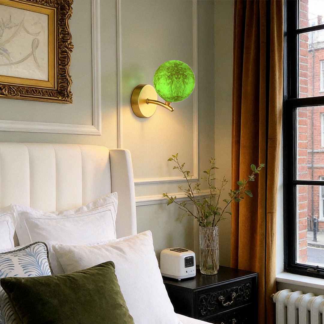 Green stained glass globe wall light in living room adding decorative accent lighting.
