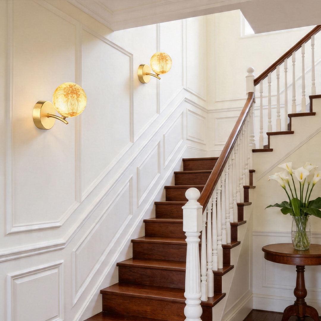 Modern staircase with multiple stained glass wall lights providing elegant illumination.