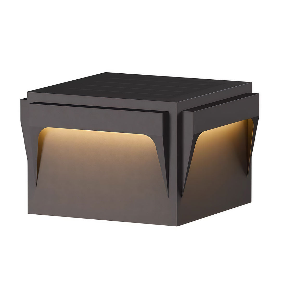Stainless steel outdoor pillar light with a minimalist design and illuminated base for pathways.