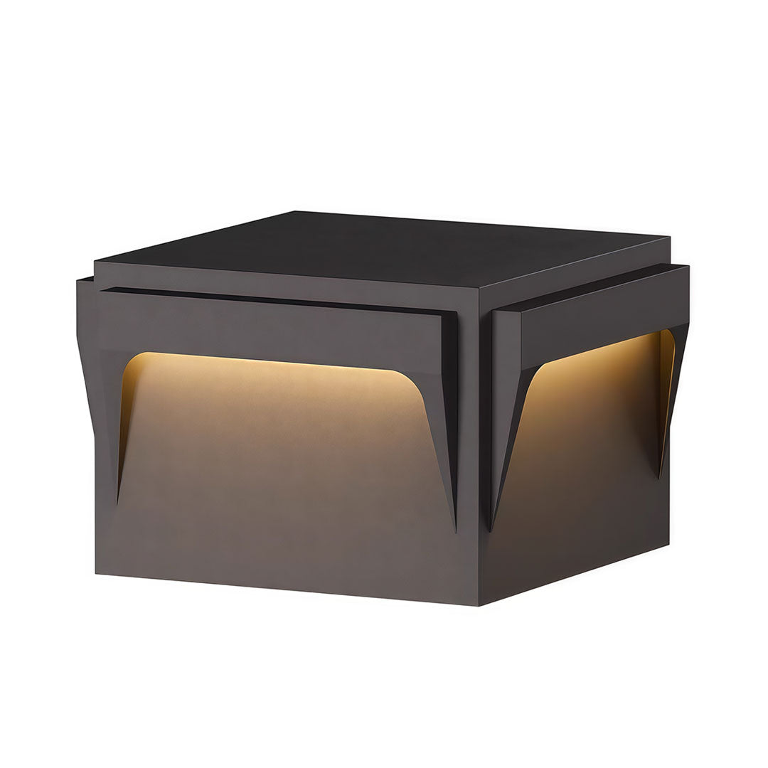 Stainless steel outdoor pillar light with a square shape and illuminated edges for ambient lighting.