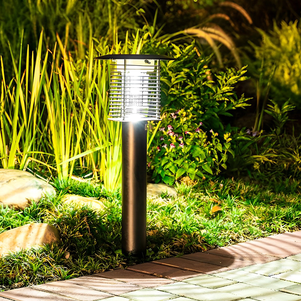 Stainless steel solar light bug zapper illuminating garden plants at night.