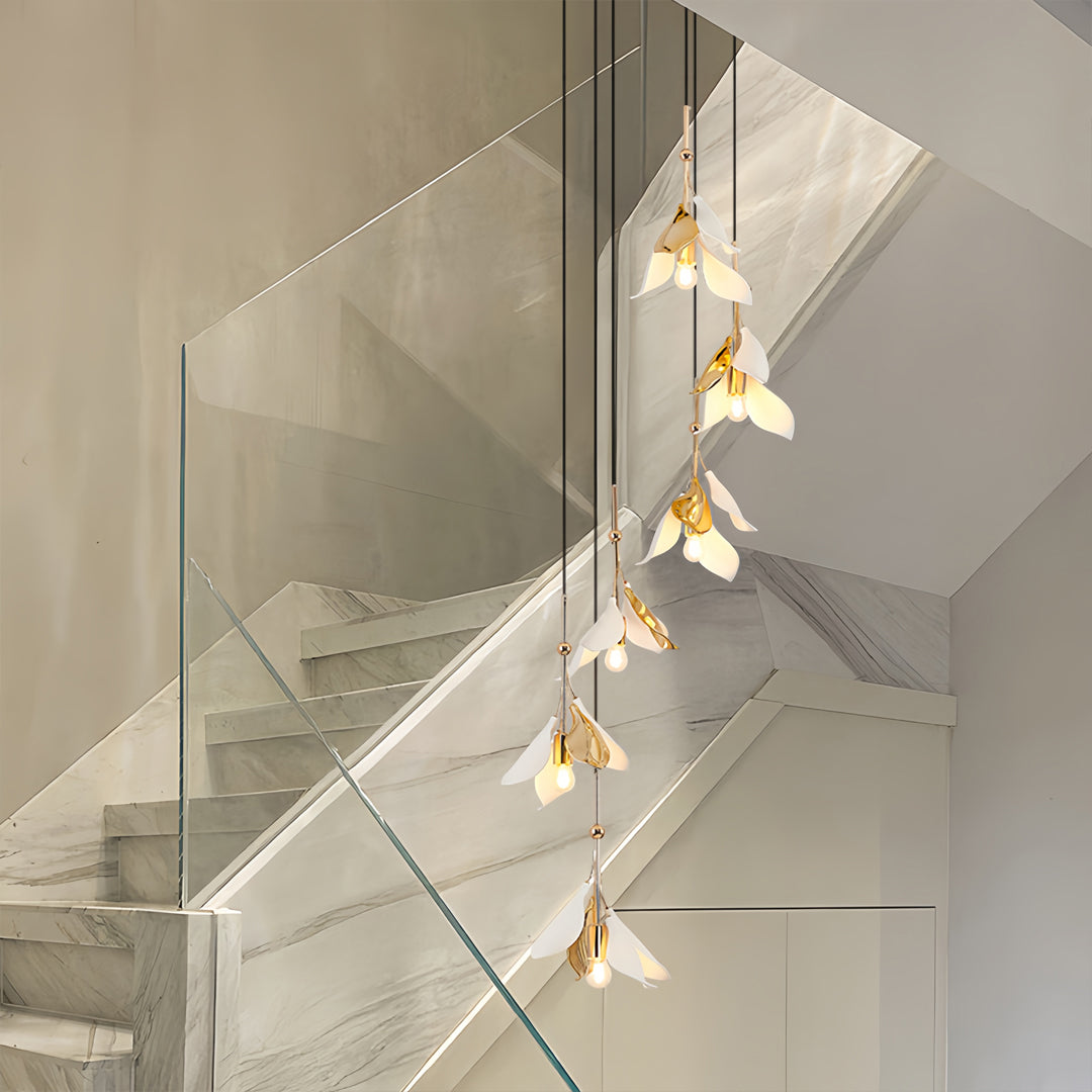 elegant multi-tier chandelier hanging in stairwell space, staircase chandelier ideas