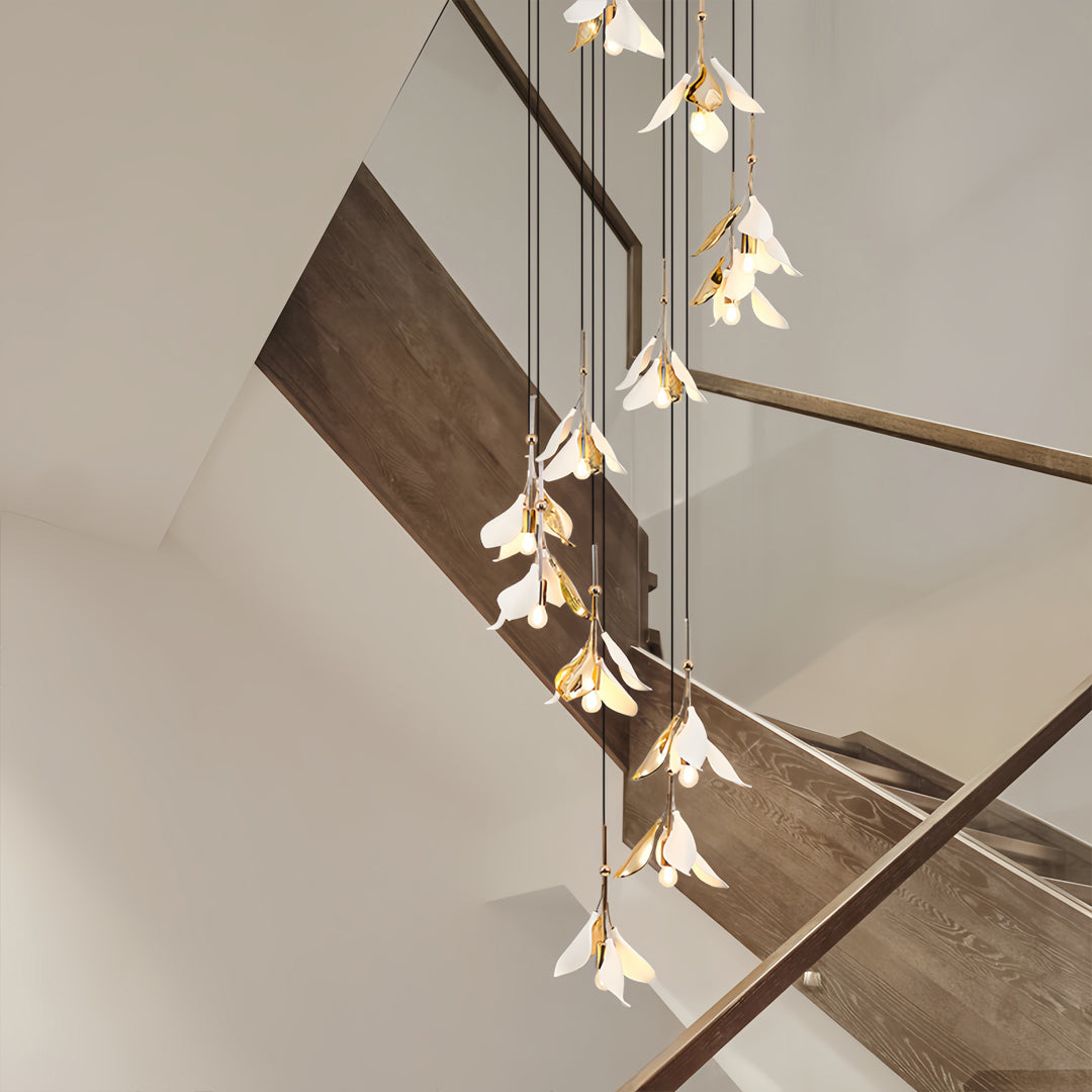 gold floral cascading chandelier displayed along open staircase, staircase chandelier ideas