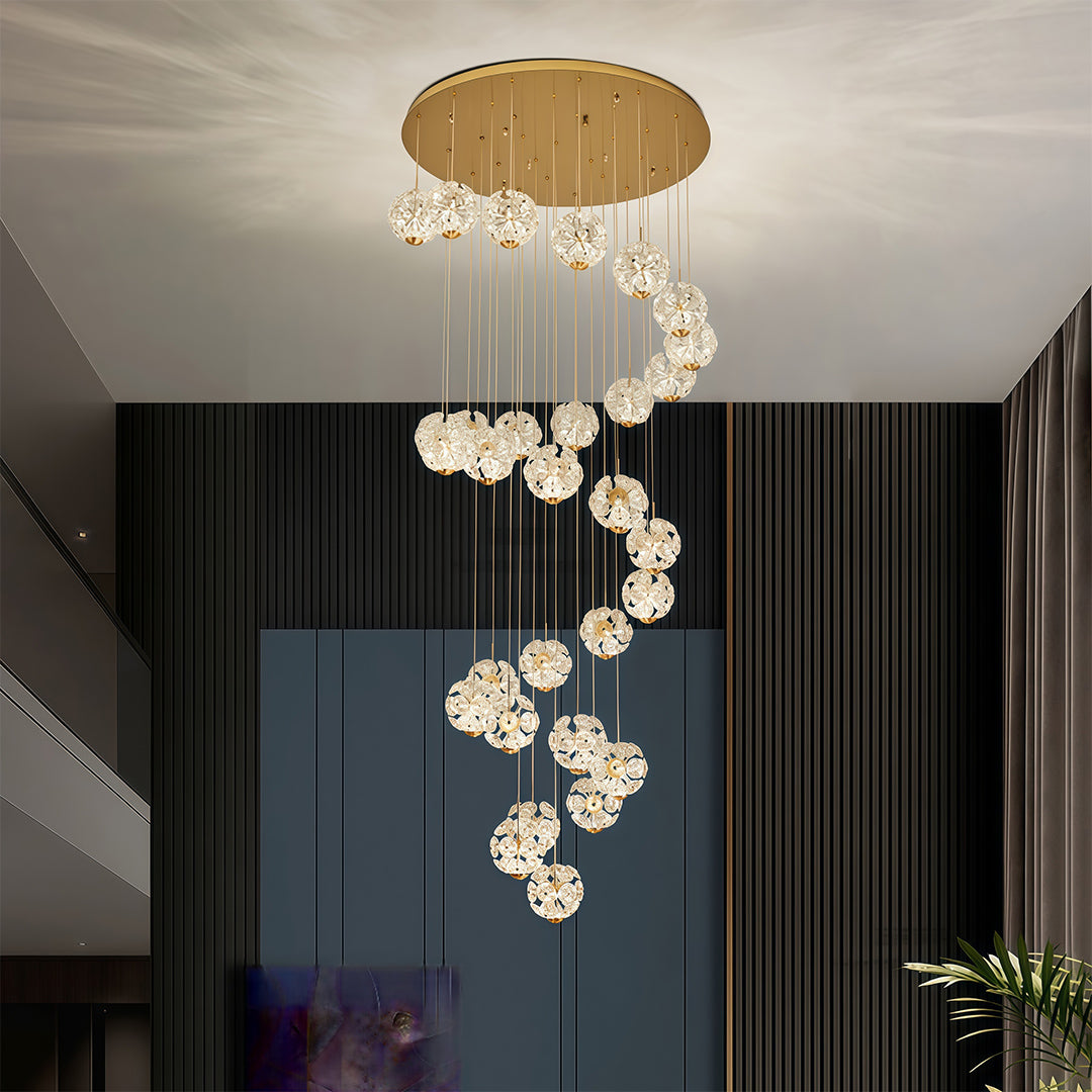 Elegant spiral crystal chandelier in a high-ceiling contemporary interior.