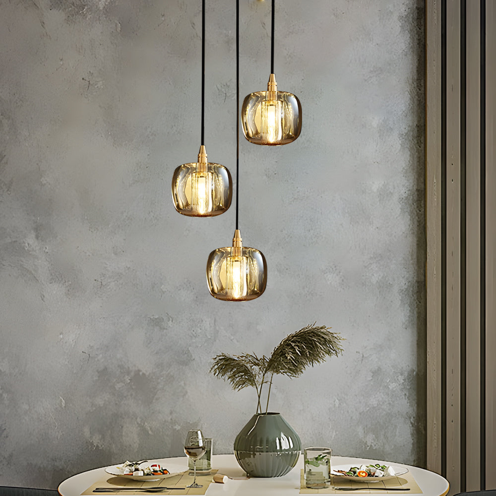 Staircase crystal chandelier with golden crystal drops, hanging in a modern living room.