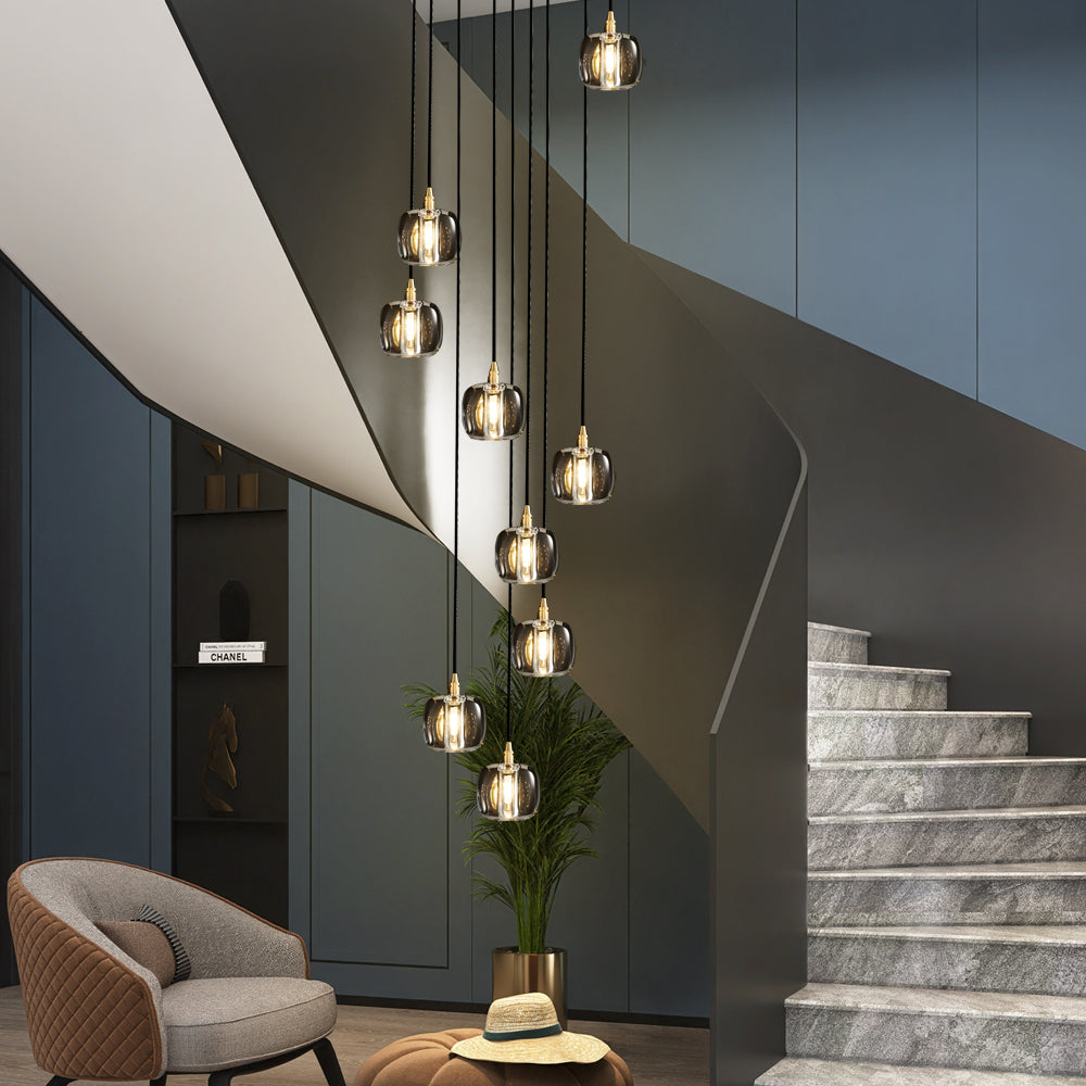 Staircase crystal chandelier with a modern design, hanging in a stylish hallway.