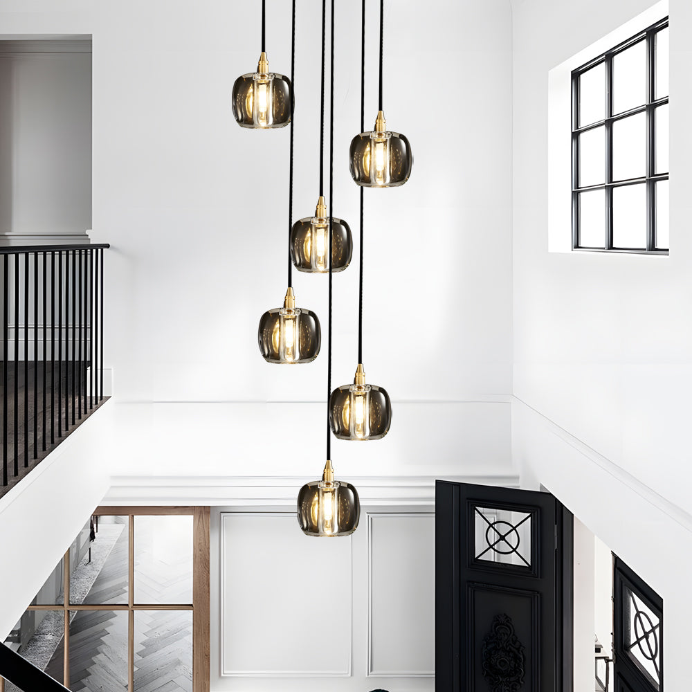 Staircase crystal chandelier with a sleek design, providing ambient lighting in a contemporary space.