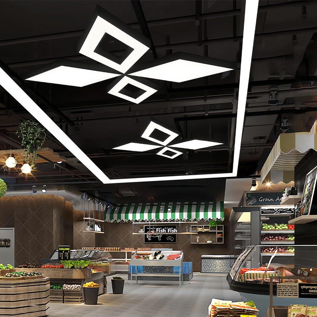 Modern black chandelier with a star-like shape, casting a unique and striking light pattern across the room.