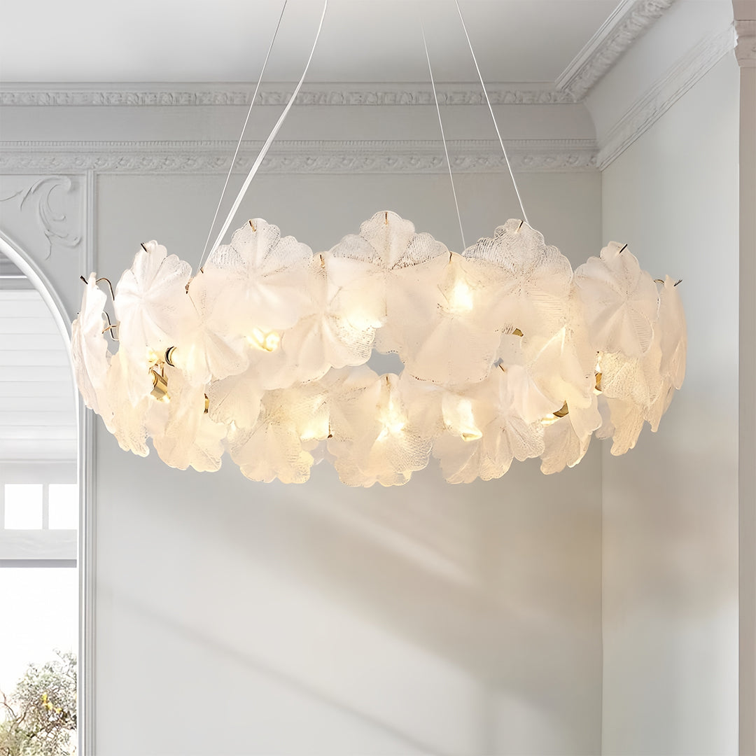 Statement glass garland chandelier lights installed in elegant dining room showcasing dramatic overhead lighting