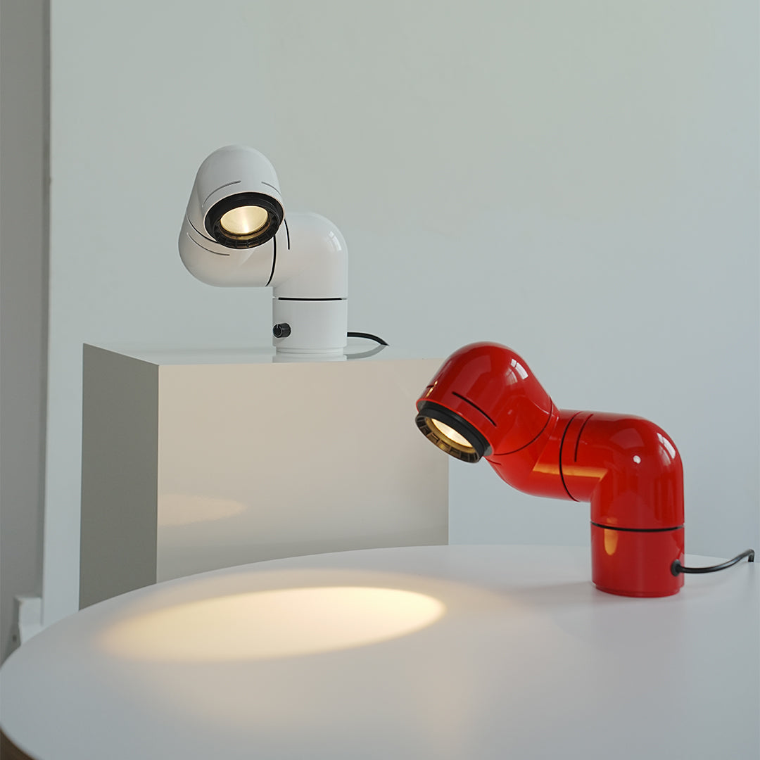 Matching red and white statement table lamps lighting up a modern living room.