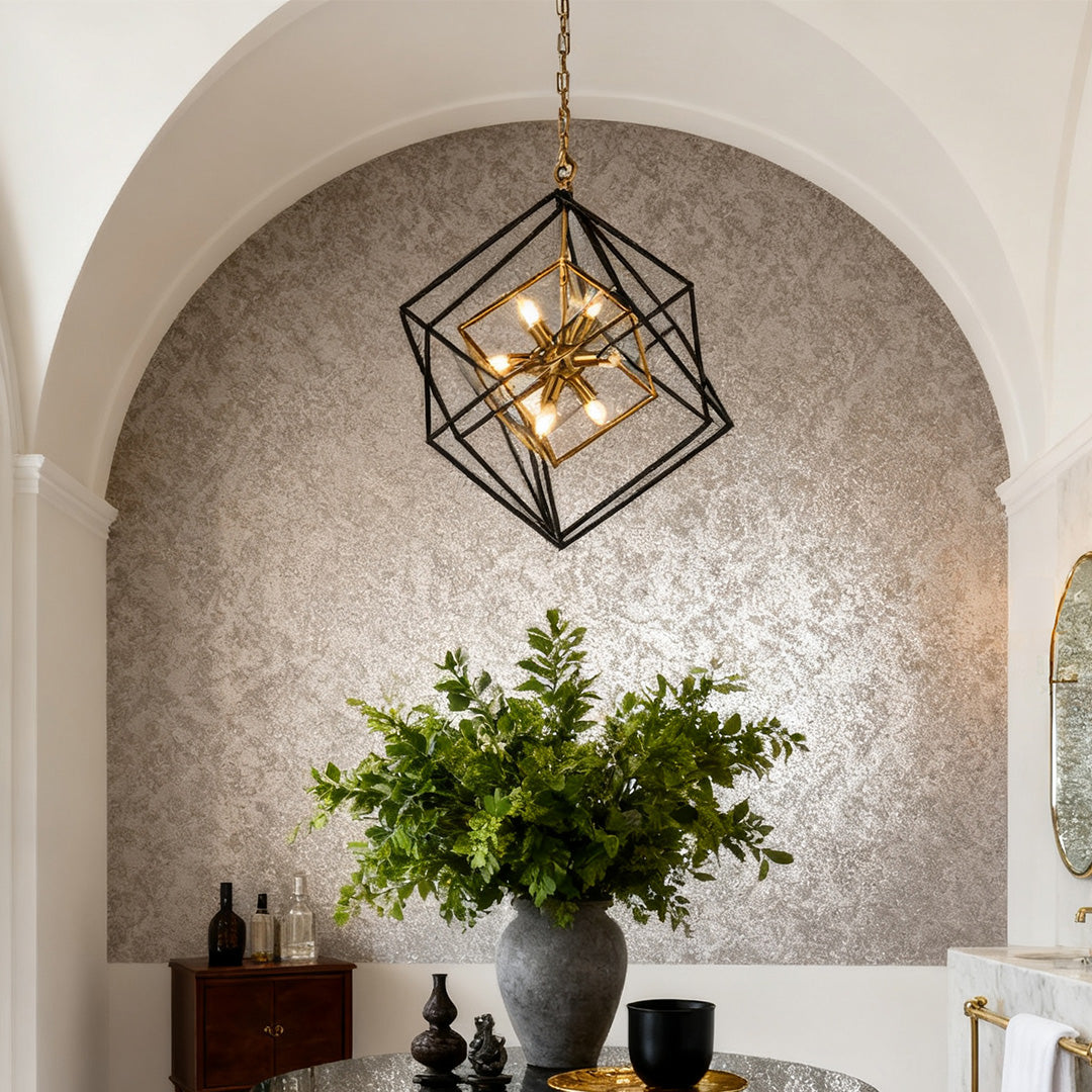 Statement square pendant lights illuminating a textured, silver accent wall and arched doorway in a transitional entryway.