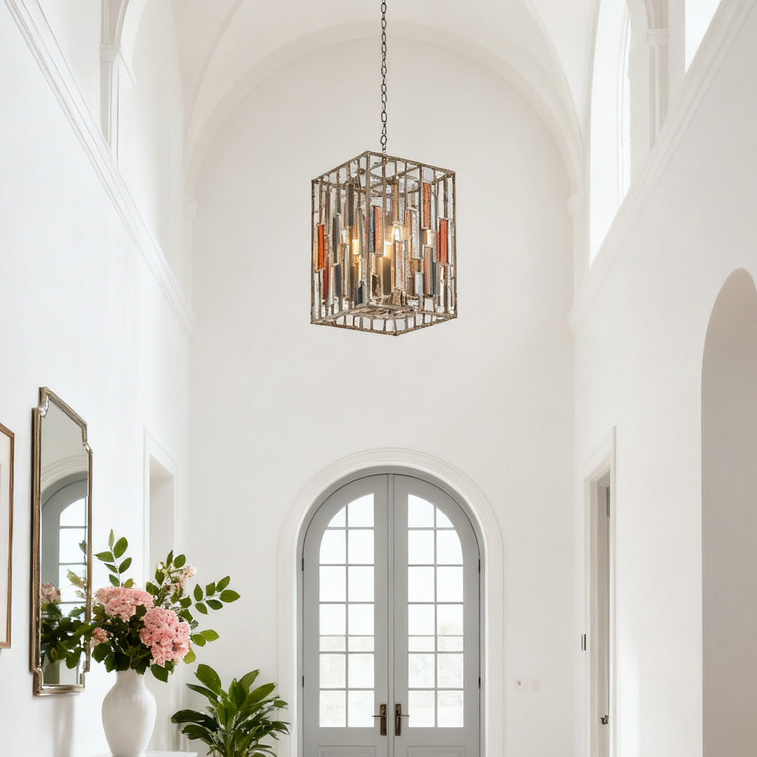 Statement vintage copper pendant light suspended high in a bright, vaulted entry hall with arched doorways and classic white trim.