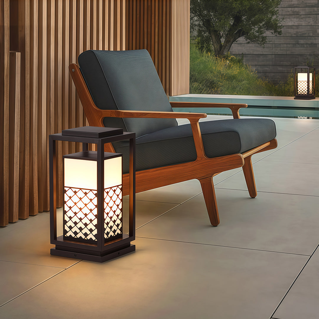 Bollard light fixture illuminating a stone pathway, creating a cozy and inviting ambiance for outdoor gatherings.
