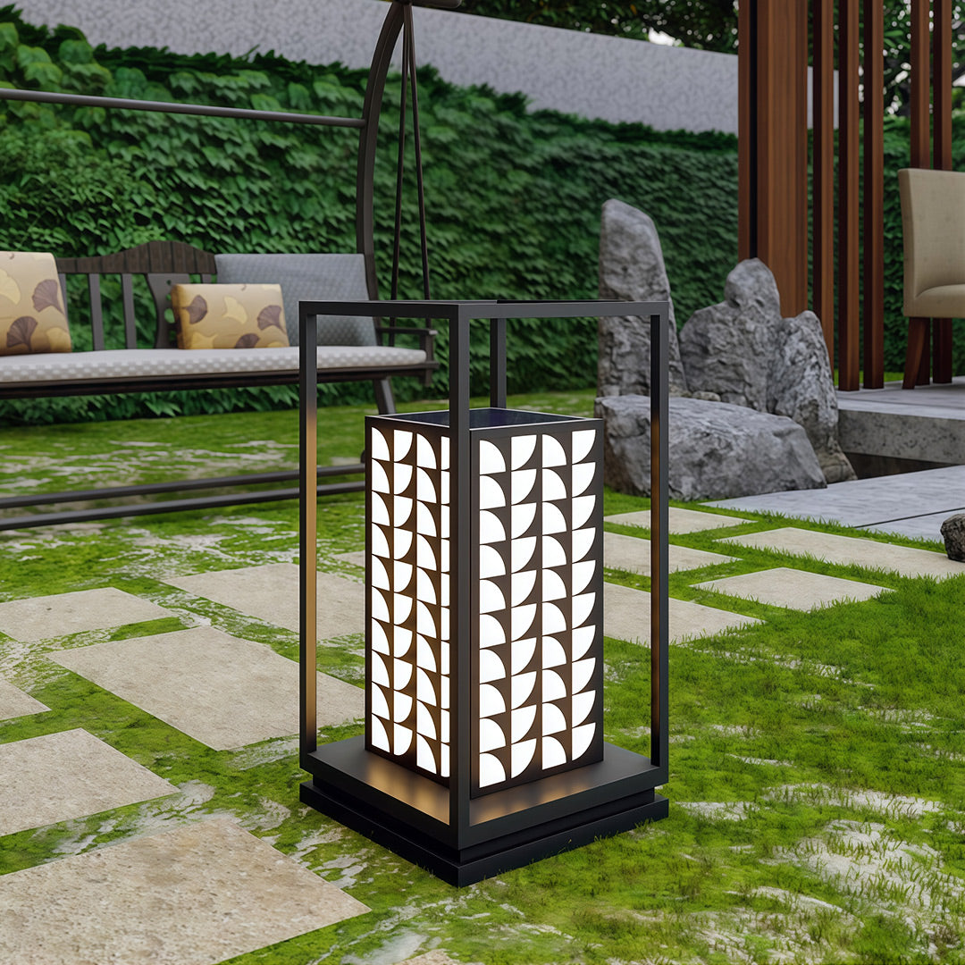 LED bollard light along a stone pathway, adding a modern touch to the garden with its sleek design.