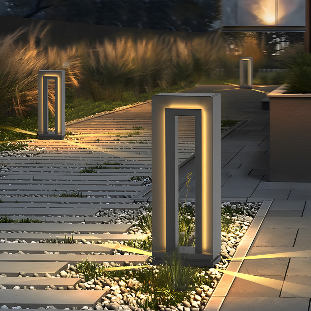 LED outdoor path lights illuminating stone pathway creating warm ambient lighting for evening garden and landscape design