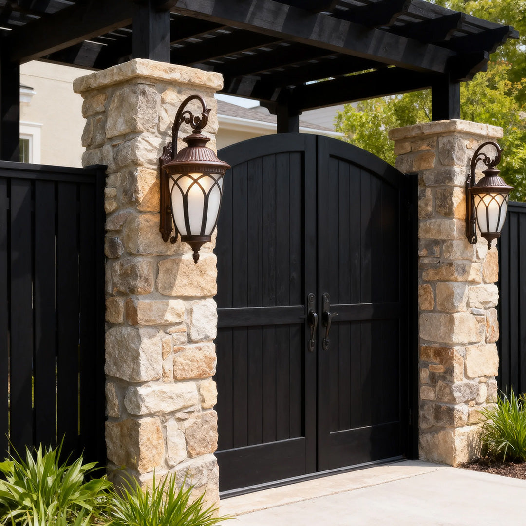 Outdoor wall light beside a stone pillar, elegant and functional exterior lighting fixture