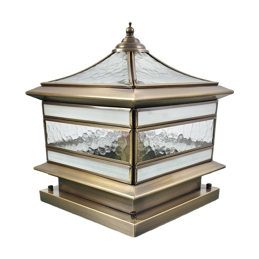 Isolated stone pillar solar light with bronze frame on white background.