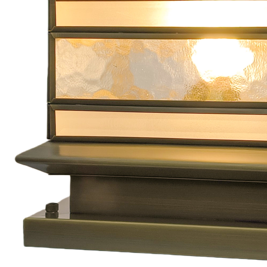 Close up view of stone pillar solar lights base and glass detailing.
