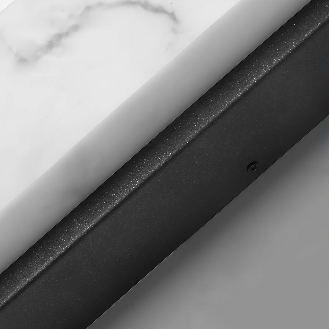 Stone texture wall light with a sleek design, enhancing a modern interior wall.