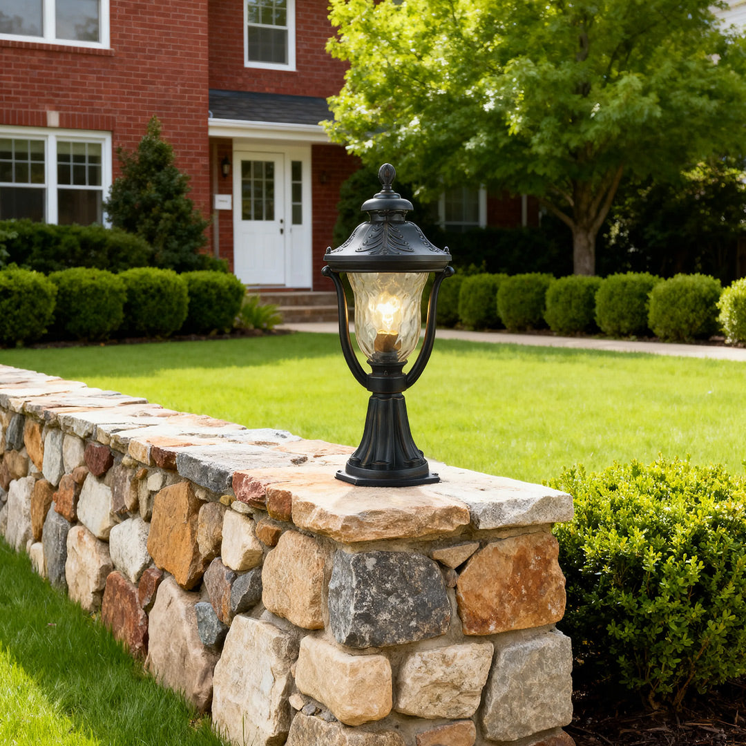Modern pillar light beside a stone wall, elegant and functional outdoor lighting solution