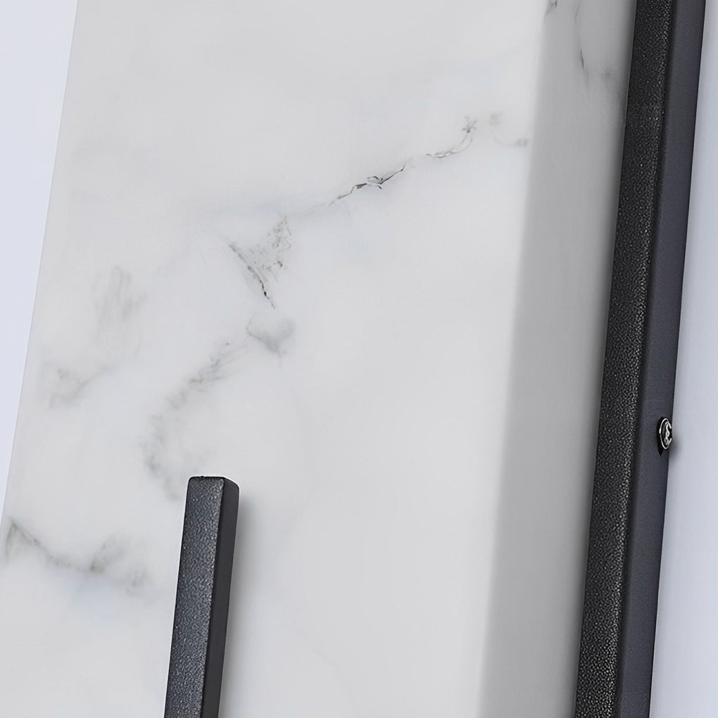 Stone wall sconce lighting close up, showcasing its minimalist design and warm glow.
