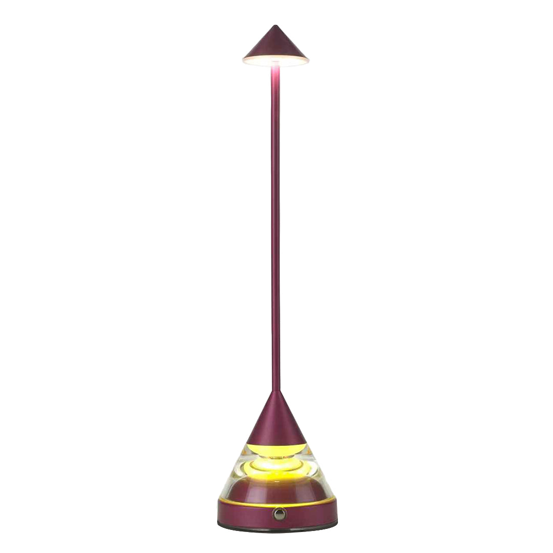 Full product view of a striking magenta unique small table lamp with a glowing, layered cone base on white.