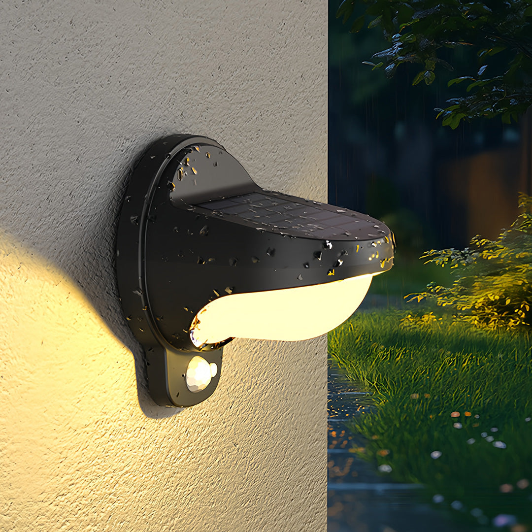 Vintage outdoor wall lights on stucco exterior wall glowing warmly at dusk.