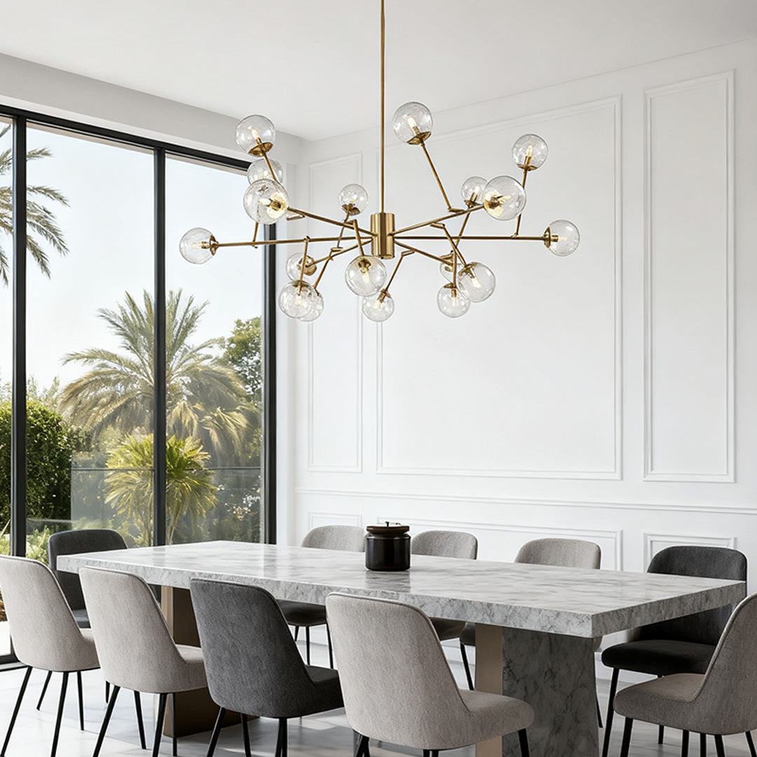 Stunning bubble sputnik chandelier with a gold finish, mounted above a fireplace in a vaulted ceiling, providing warm, diffused light.